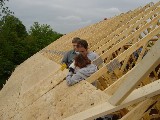 Josh Pitlick and Catherine Bocskor securing a roof panel.
