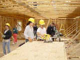 Jacylyn McKelvey getting some pointers from Habitat's Eric.